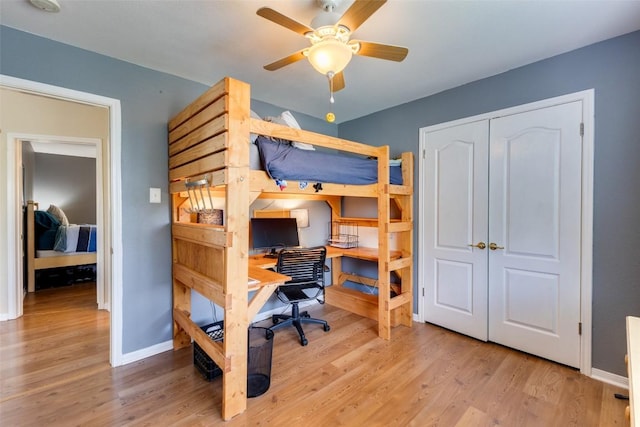 1433 Jenna Ln, Cedar Park, TX 78613 - bedroom with a desk, wood finished floors, baseboards, and a closet
