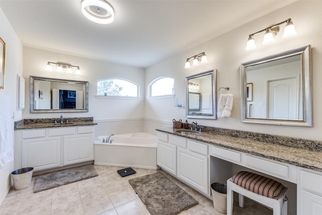 1433 Jenna Ln, Cedar Park, TX 78613 - bathroom featuring two vanities, a garden tub, and tile patterned floors