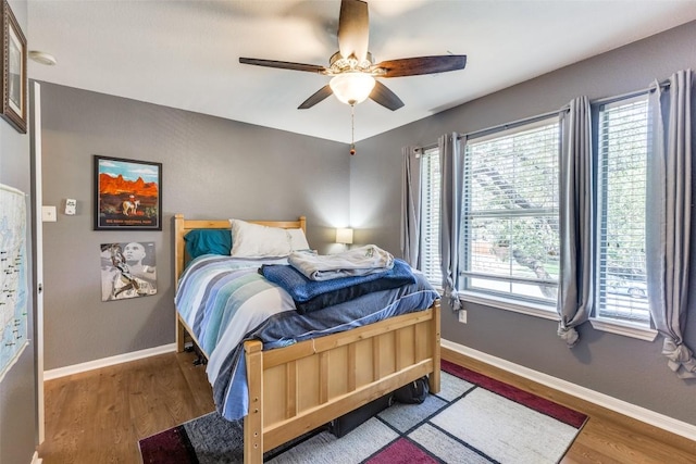 1433 Jenna Ln, Cedar Park, TX 78613 - bedroom with wood finished floors, baseboards, and a ceiling fan