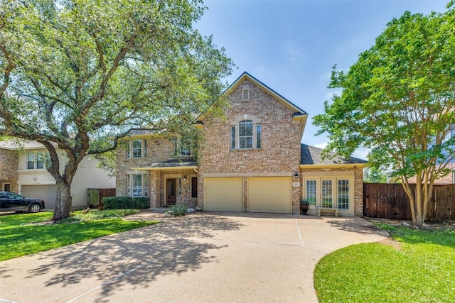 1433 Jenna Ln, Cedar Park, TX 78613 - traditional-style home with concrete driveway, a garage, and brick siding