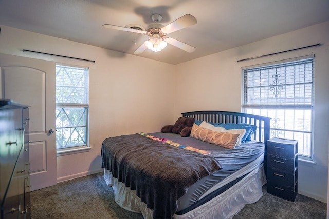 2607 Monticello Ct, San Antonio, TX 78223 - bedroom featuring dark colored carpet, multiple windows, and a ceiling fan