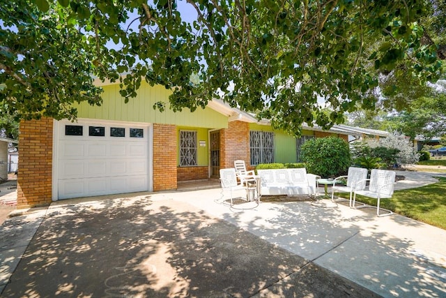 2607 Monticello Ct, San Antonio, TX 78223 - view of front of property featuring brick siding, an attached garage, and driveway