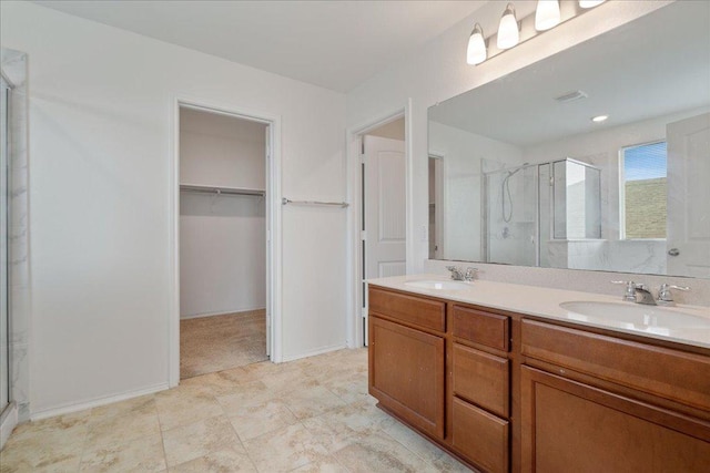14302 Honey Gem Dr, Pflugerville, TX 78660 - bathroom with a stall shower, a walk in closet, and double vanity