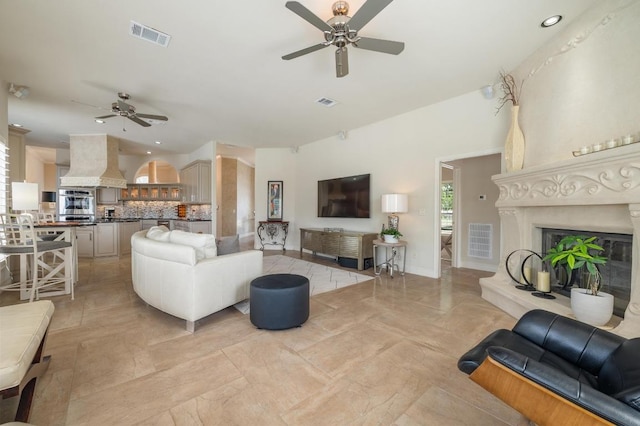 20503 Hoover Cv, Lago Vista, TX 78645 - living area with a ceiling fan, a fireplace, and recessed lighting