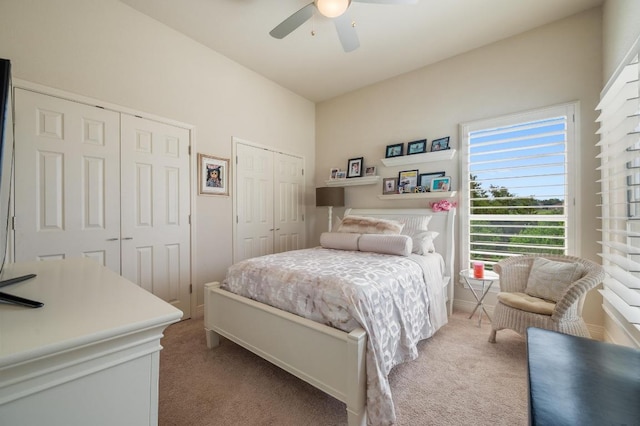 20503 Hoover Cv, Lago Vista, TX 78645 - bedroom with two closets, carpet flooring, and a ceiling fan