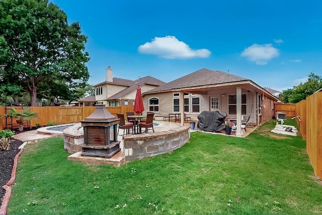 320 Atlanta Park Dr, Georgetown, TX 78628 - rear view of house featuring a fire pit and a patio