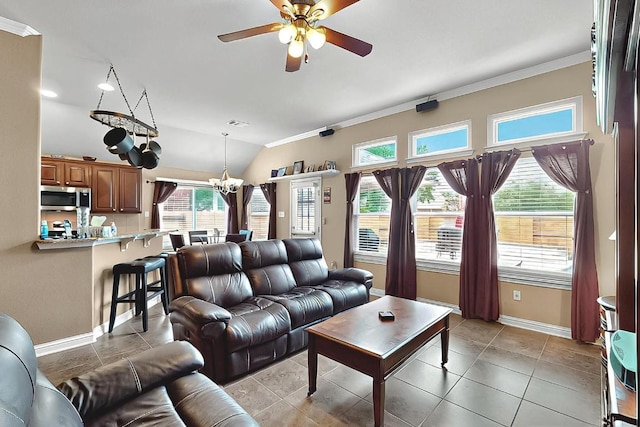 320 Atlanta Park Dr, Georgetown, TX 78628 - living area featuring crown molding, ceiling fan, baseboards, a chandelier, and vaulted ceiling