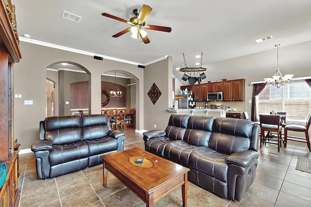 320 Atlanta Park Dr, Georgetown, TX 78628 - living area featuring a chandelier, arched walkways, ceiling fan, light tile patterned floors, and crown molding