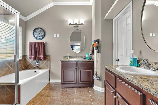 320 Atlanta Park Dr, Georgetown, TX 78628 - bathroom with ornamental molding, vaulted ceiling, a bath, two vanities, and baseboards