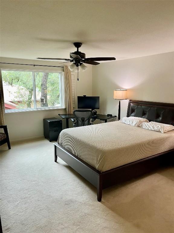 4107 Columbine Dr, Austin, TX 78727 - bedroom featuring light colored carpet, baseboards, and a ceiling fan