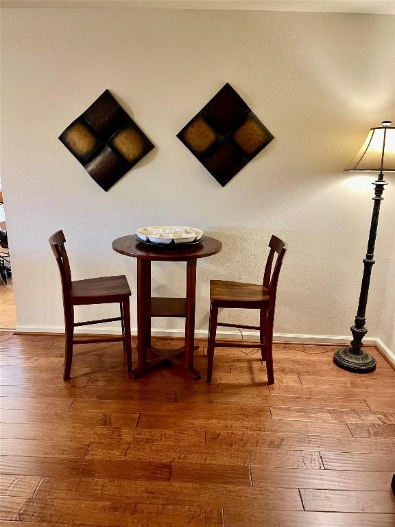 4107 Columbine Dr, Austin, TX 78727 - dining space featuring wood-type flooring and baseboards
