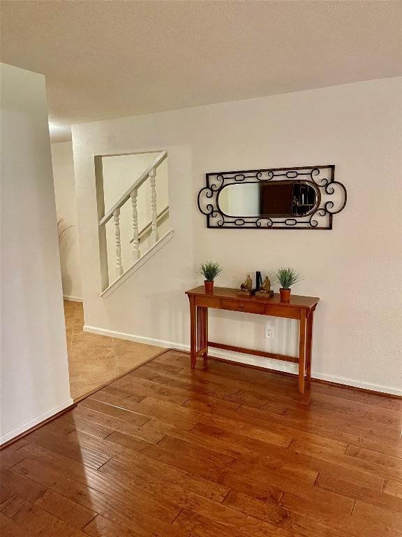 4107 Columbine Dr, Austin, TX 78727 - hallway with hardwood / wood-style flooring and baseboards