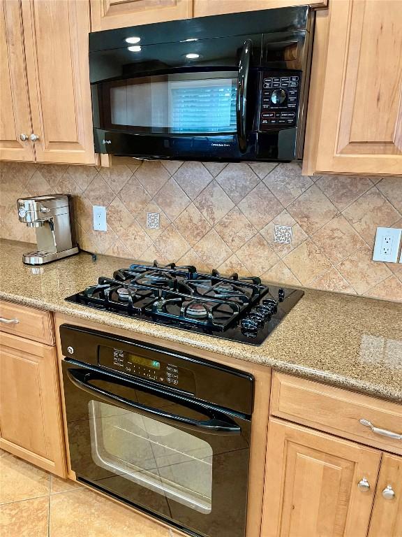 4107 Columbine Dr, Austin, TX 78727 - kitchen with black appliances, backsplash, light brown cabinets, and light stone counters