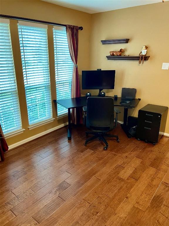 4107 Columbine Dr, Austin, TX 78727 - office space featuring wood finished floors, healthy amount of natural light, and baseboards