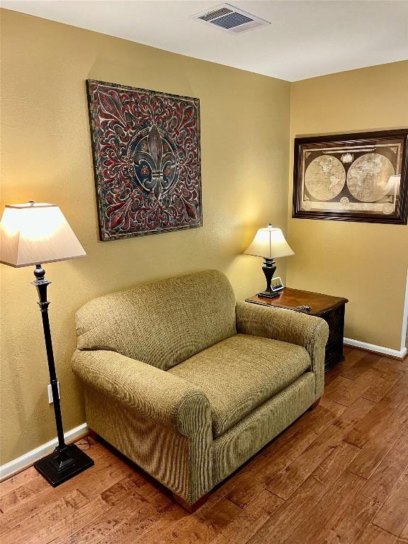 4107 Columbine Dr, Austin, TX 78727 - sitting room with wood finished floors and baseboards