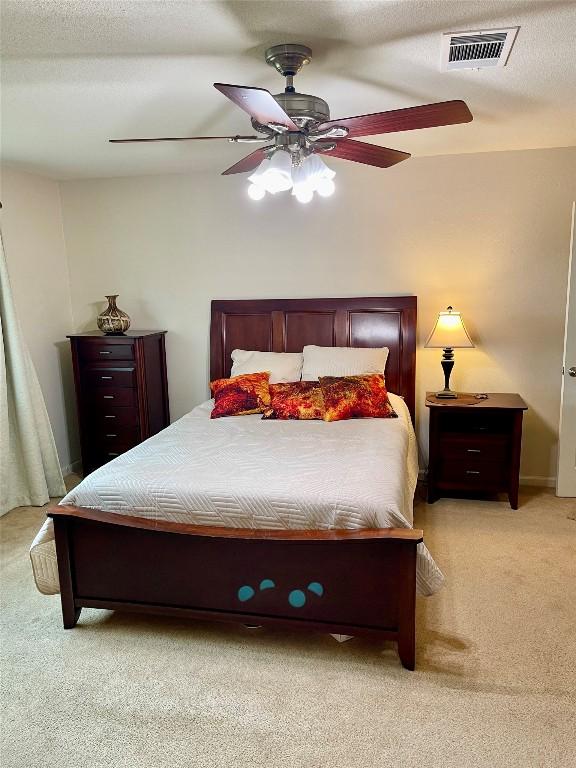 4107 Columbine Dr, Austin, TX 78727 - bedroom featuring light colored carpet and ceiling fan