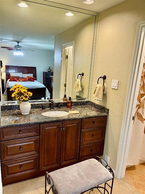 4107 Columbine Dr, Austin, TX 78727 - ensuite bathroom with vanity, ceiling fan, a textured wall, and recessed lighting