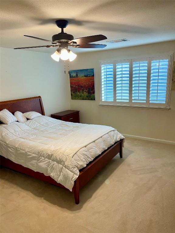 4107 Columbine Dr, Austin, TX 78727 - carpeted bedroom featuring a ceiling fan and baseboards