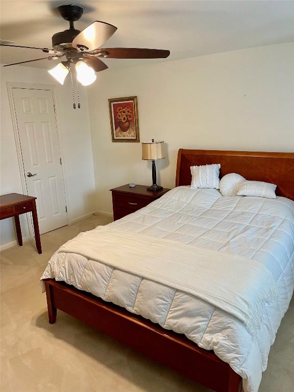 4107 Columbine Dr, Austin, TX 78727 - bedroom featuring light carpet, a ceiling fan, and baseboards
