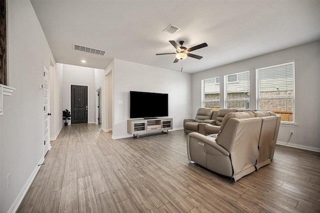 265 Fawn River Run, Kyle, TX 78640 - living room with a ceiling fan, wood finished floors, and baseboards