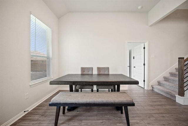 265 Fawn River Run, Kyle, TX 78640 - dining room featuring vaulted ceiling, stairs, wood finished floors, and baseboards