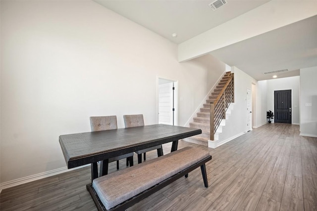 265 Fawn River Run, Kyle, TX 78640 - dining room with stairs, baseboards, and wood finished floors
