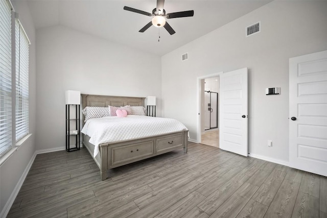 265 Fawn River Run, Kyle, TX 78640 - bedroom with wood finished floors, baseboards, lofted ceiling, and ceiling fan