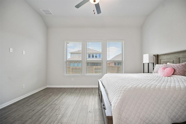 265 Fawn River Run, Kyle, TX 78640 - bedroom with vaulted ceiling, wood finished floors, baseboards, and a ceiling fan