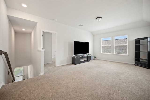 265 Fawn River Run, Kyle, TX 78640 - unfurnished living room featuring light carpet, baseboards, and recessed lighting