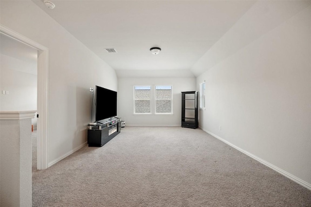 265 Fawn River Run, Kyle, TX 78640 - unfurnished living room featuring carpet and baseboards
