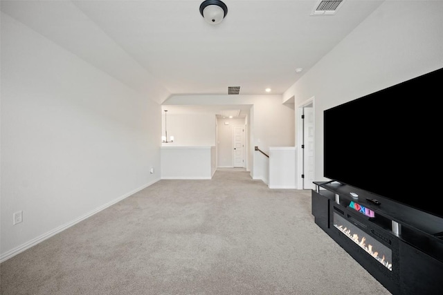 265 Fawn River Run, Kyle, TX 78640 - unfurnished living room featuring carpet floors and baseboards
