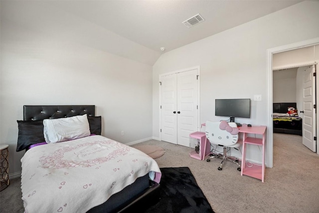 265 Fawn River Run, Kyle, TX 78640 - bedroom featuring carpet floors, a closet, lofted ceiling, and baseboards