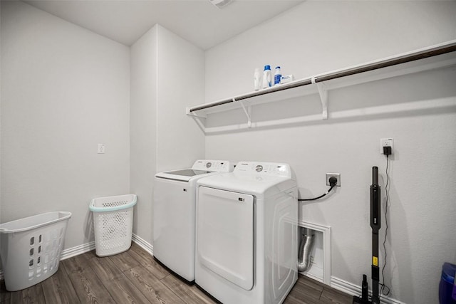 265 Fawn River Run, Kyle, TX 78640 - washroom with washing machine and clothes dryer, wood finished floors, and baseboards