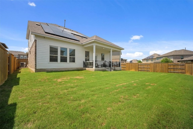 265 Fawn River Run, Kyle, TX 78640 - back of house with solar panels and central AC unit