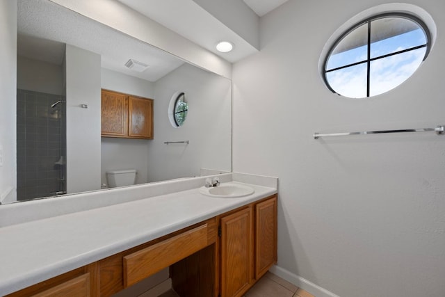 8407 Mount Shasta Cv, Round Rock, TX 78681 - bathroom with vanity, a shower, toilet, baseboards, and tile patterned floors