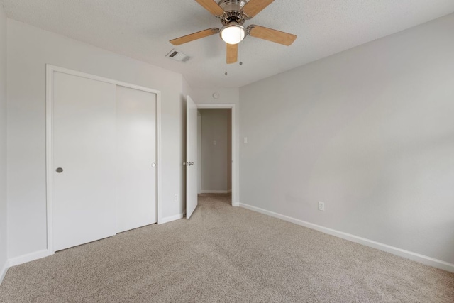 8407 Mount Shasta Cv, Round Rock, TX 78681 - unfurnished bedroom featuring light carpet, a closet, baseboards, and ceiling fan