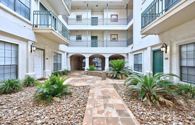 1908 San Antonio St Unit 313, Austin, TX 78705 - doorway to property with stucco siding