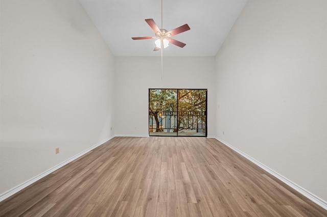 1908 San Antonio St Unit 313, Austin, TX 78705 - empty room with high vaulted ceiling, wood finished floors, a ceiling fan, and baseboards