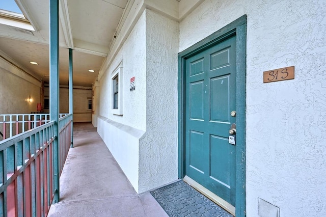 1908 San Antonio St Unit 313, Austin, TX 78705 - view of exterior entry with stucco siding