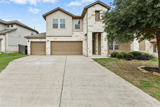 13208 Olivers Way, Manchaca, TX 78652 - multi unit property with board and batten siding, driveway, stone siding, and an attached garage
