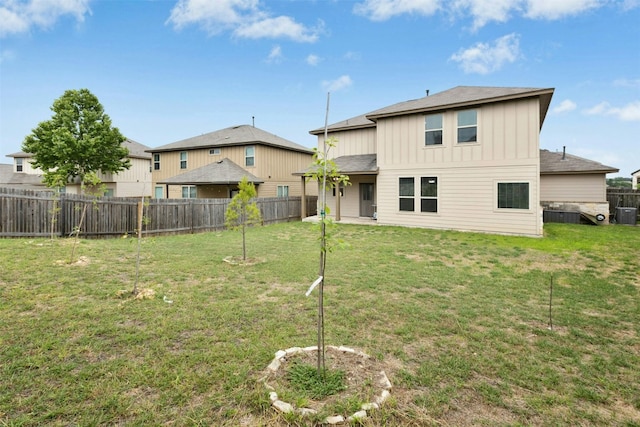 13208 Olivers Way, Manchaca, TX 78652 - back of house with board and batten siding and cooling unit