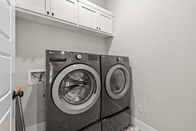 286 Canal Dr, Dripping Springs, TX 78620 - laundry area with independent washer and dryer, cabinet space, and baseboards