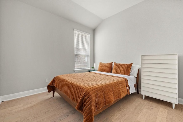 286 Canal Dr, Dripping Springs, TX 78620 - bedroom with wood finished floors, vaulted ceiling, and baseboards