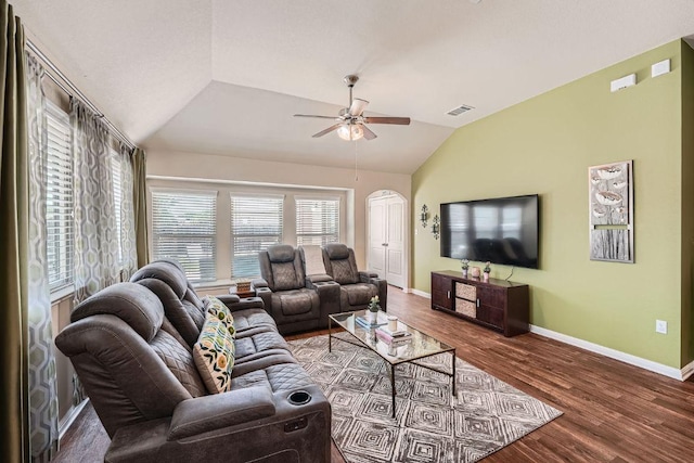 814 Hatton Hill Ct, Austin, TX 78725 - living area with vaulted ceiling, ceiling fan, baseboards, wood finished floors, and arched walkways