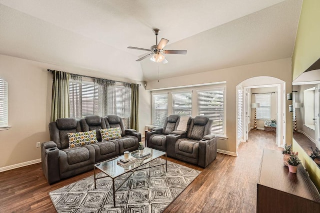 814 Hatton Hill Ct, Austin, TX 78725 - living area featuring lofted ceiling, ceiling fan, arched walkways, wood finished floors, and baseboards