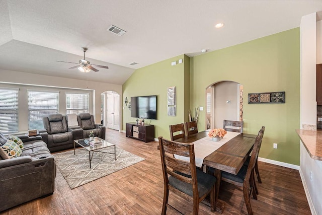 814 Hatton Hill Ct, Austin, TX 78725 - dining room with arched walkways, wood finished floors, lofted ceiling, and ceiling fan