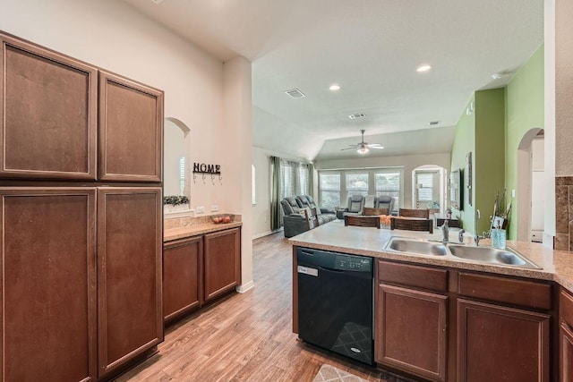 814 Hatton Hill Ct, Austin, TX 78725 - kitchen with dishwasher, a sink, ceiling fan, arched walkways, and light wood-type flooring