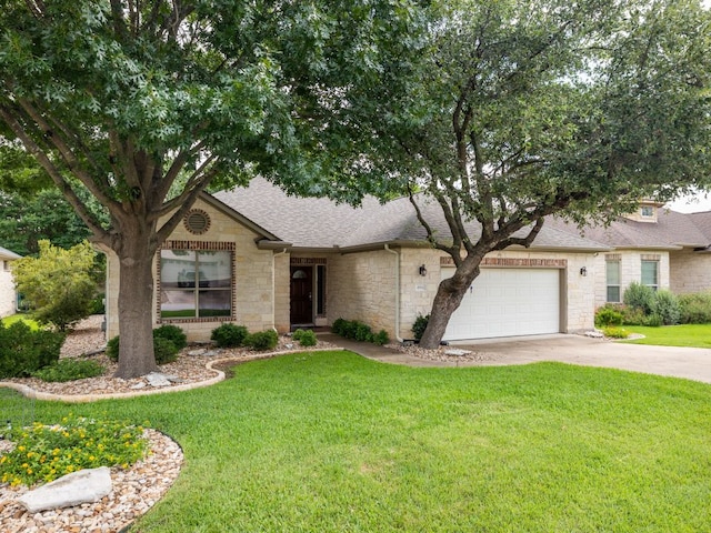 4914 Big Bend Trl, Georgetown, TX 78633 - view of front facade with stone siding, roof with shingles, concrete driveway, a front lawn, and an attached garage