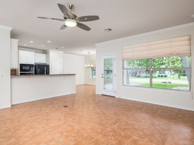 4914 Big Bend Trl, Georgetown, TX 78633 - unfurnished living room with crown molding, a chandelier, a ceiling fan, light tile patterned flooring, and recessed lighting