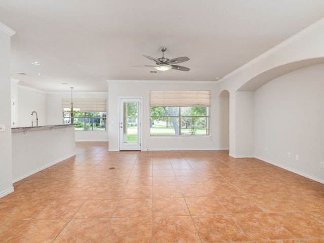 4914 Big Bend Trl, Georgetown, TX 78633 - unfurnished living room with crown molding, ceiling fan, light tile patterned floors, a chandelier, and baseboards